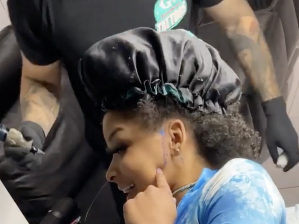 Blueface’s First Signee Gets His Name Tattooed Onto Her Face