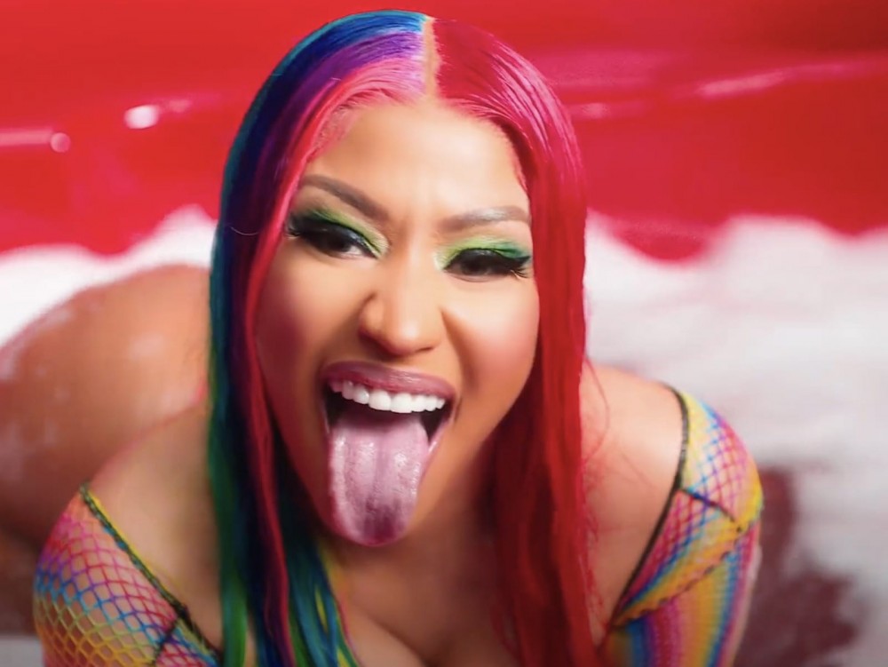 Nicki Minaj goes topless in latest new music announcement