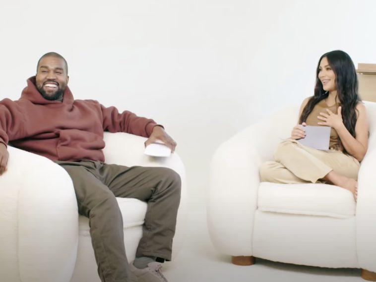 Kanye West and Kim Kardashian sitting together